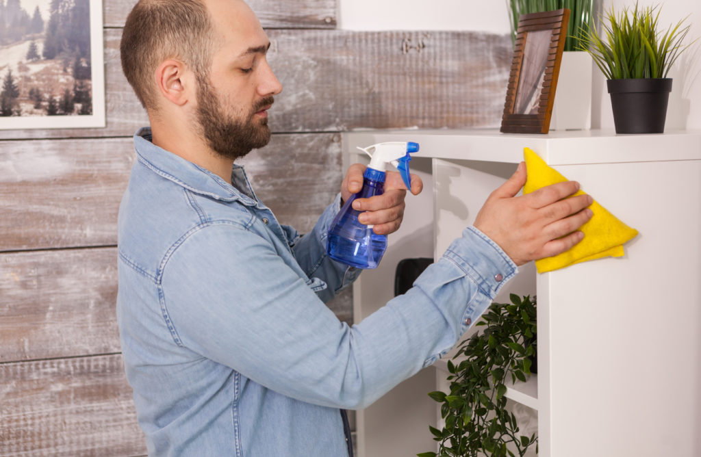 Man cleaning dust with organic cleaning solution