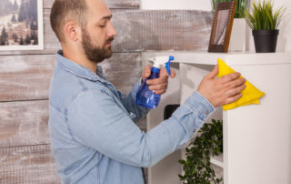 Man cleaning dust with organic cleaning solution