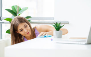 young woman from Shine2Clean, using natural organic products in the cleaning home